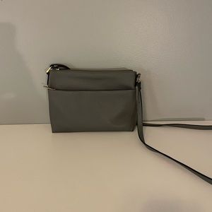 gray purse with gold accents
